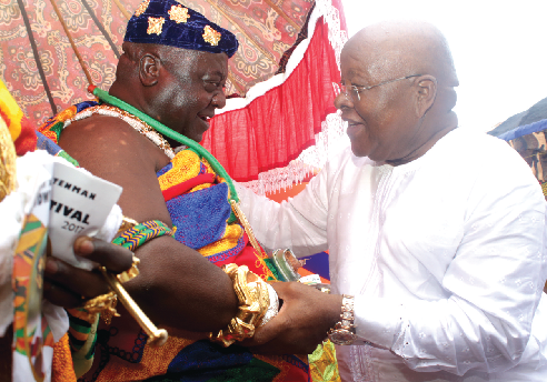 Otobour Djan Kwasi Il (left), the Aburihene, welcoming the Speaker of Parliament, Professor Mike Aaron Oquaye to the festival