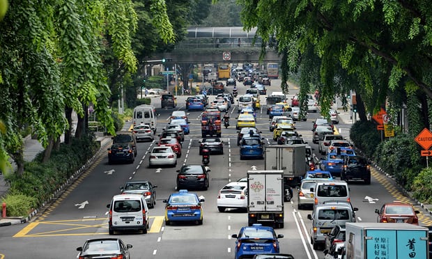 Motorists enter the financial district area in Singapore. Photograph: Roslan Rahman/AFP/Getty Images Motorists enter the financial district area in Singapore. Photograph: Roslan Rahman/AFP/Getty Images