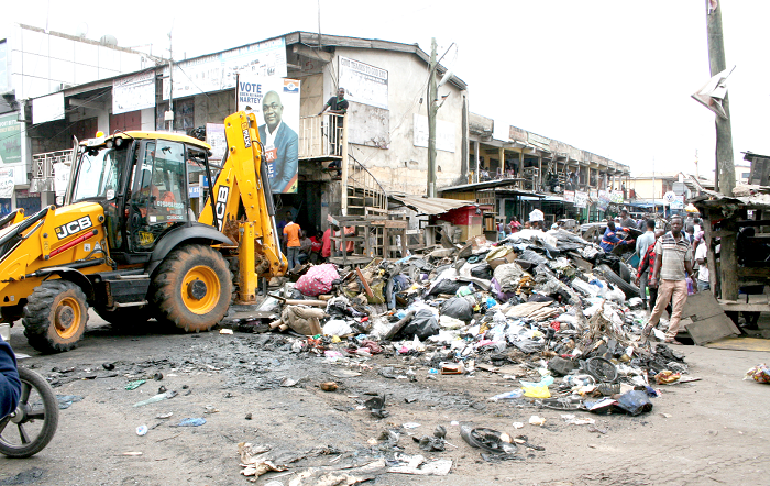 Some residents of Abossey Okai clearing refuse. Picture: INNOCENT K. OWUSU Some residents of Abossey Okai clearing refuse. Picture: INNOCENT K. OWUSU