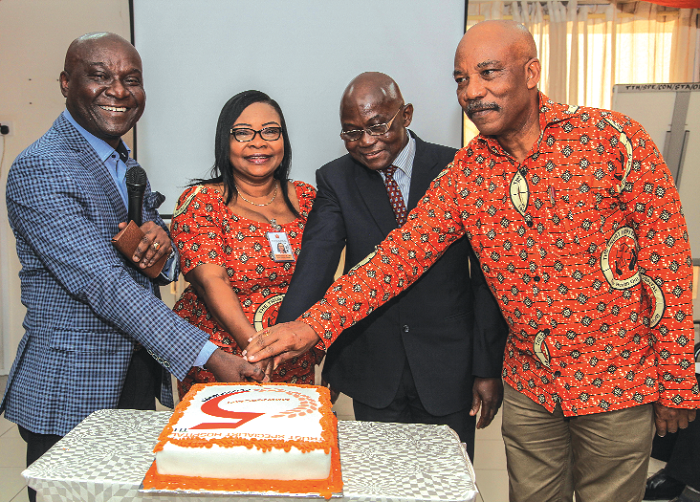 Dr Darius Osei (left) joined by Dr Addo-Yobo (2nd right) and other management members to cut the anniverssary cake Dr Darius Osei (left) joined by Dr Addo-Yobo (2nd right) and other management members to cut the anniverssary cake