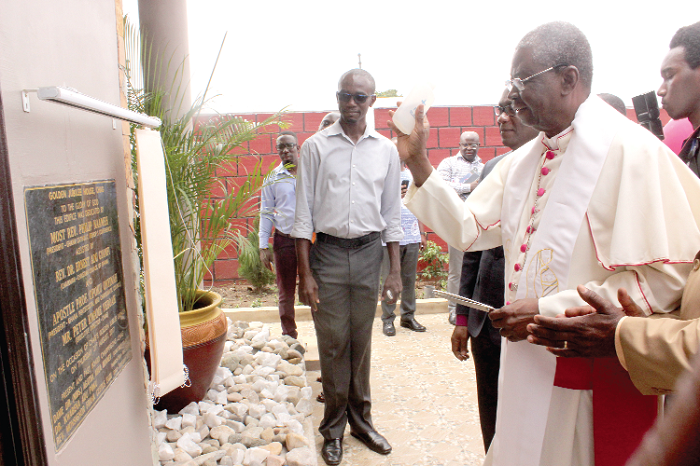The Most Rev. Philip Naameh (right), the President, Ghana Catholic Bishops' Conference, consecrating the building. The Most Rev. Philip Naameh (right), the President, Ghana Catholic Bishops' Conference, consecrating the building.