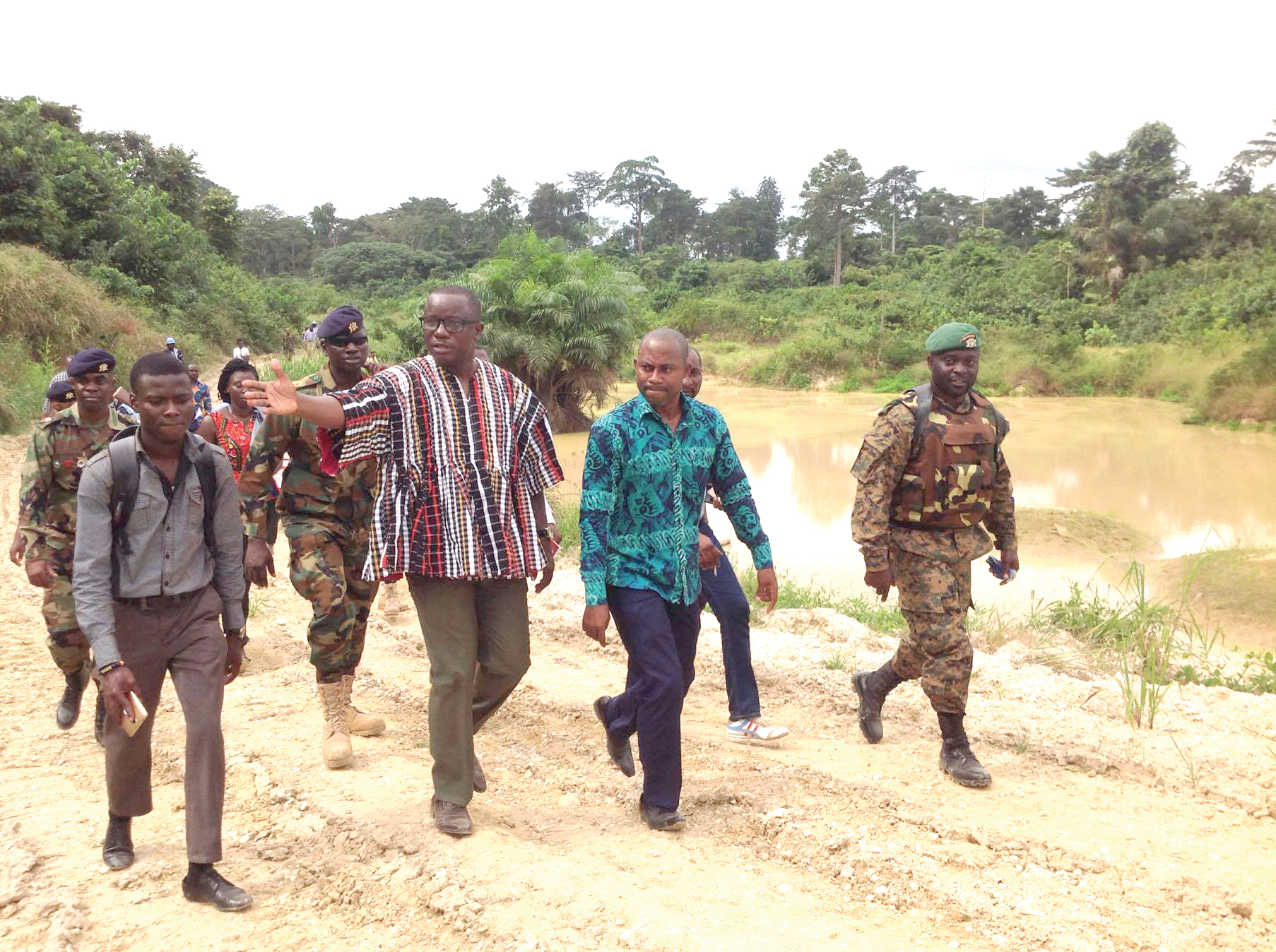 Mr Dominic Nitiwul (in smock) being conducted round a galamsey site in Tarkwa Mr Dominic Nitiwul (in smock) being conducted round a galamsey site in Tarkwa