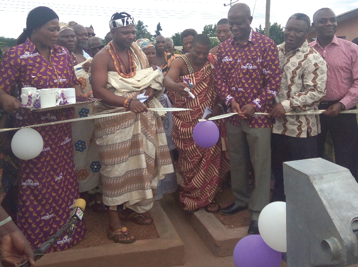 Nana Amoah II (3rd left), the Chief of Akpafu Mempeasem, cutting the tape to inaugurate one of the boreholes. With him are Mr Osei Asafo-Adjei (3rd right) and other dignitaries. Nana Amoah II (3rd left), the Chief of Akpafu Mempeasem, cutting the tape to inaugurate one of the boreholes. With him are Mr Osei Asafo-Adjei (3rd right) and other dignitaries.