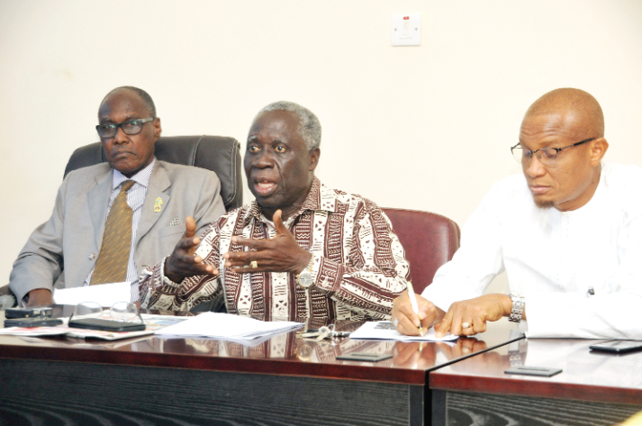 Mr Yaw Safo-Maafo addressing the meeting. With him are Mr Mustapha Abdul-Hamid (right), the Minister of Information, and Mr Robert Kwabena Kyei, the Technical Advisor to the Senior Minister