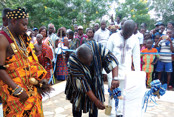 Mr Blagogee turning the tap to inaugurate the water facility Mr Blagogee turning the tap to inaugurate the water facility