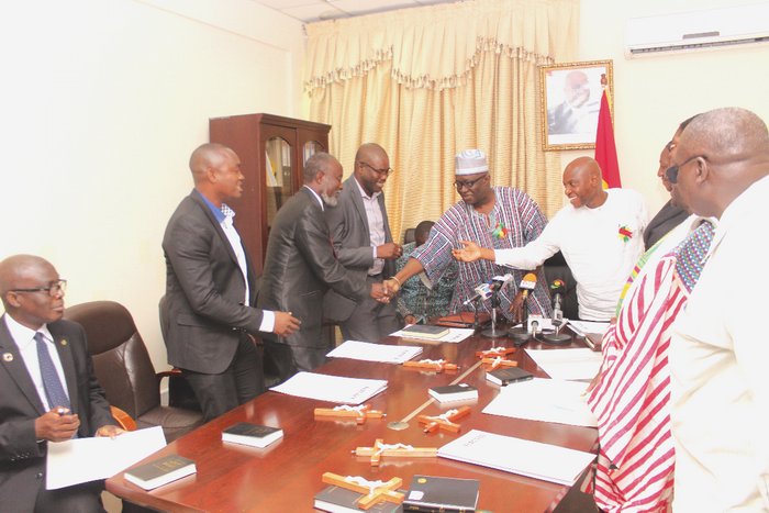 Mr Kofi Adda (4th left) congratulating members of the GWCL Board after the inauguration. Mr Kofi Adda (4th left) congratulating members of the GWCL Board after the inauguration.