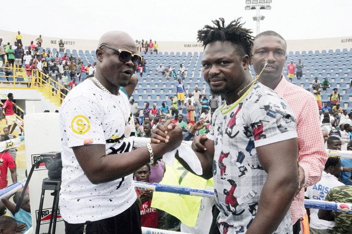 Braimah Kamoko (left) shaking hands with Bastie Samir Braimah Kamoko (left) shaking hands with Bastie Samir