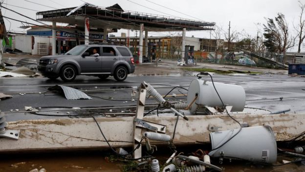 Hurricane Maria damaged buildings in Puerto Rico and left streets covered in debris Hurricane Maria damaged buildings in Puerto Rico and left streets covered in debris