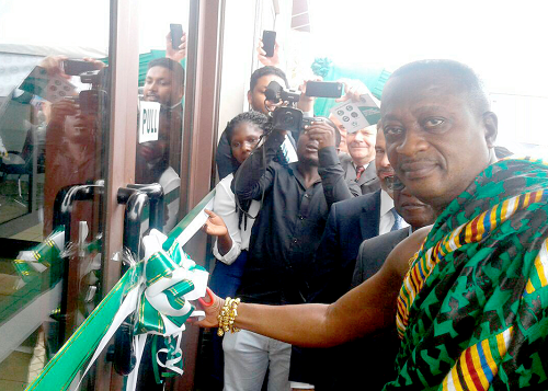 The Bantamahene cutting the tape to inaugurate the new office complex for Ecom Ghana Ltd in the Ark building in Kumasi The Bantamahene cutting the tape to inaugurate the new office complex for Ecom Ghana Ltd in the Ark building in Kumasi