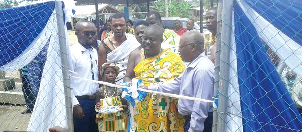 Nana Akye Blay, Chief of Menzezor, and Mr Charles Darko (right), MD, Tullow Ghana, cutting a tape to officially hand over the water system. Nana Akye Blay, Chief of Menzezor, and Mr Charles Darko (right), MD, Tullow Ghana, cutting a tape to officially hand over the water system.
