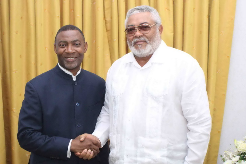 Rawlings and Lawrence Tetteh Rawlings and Lawrence Tetteh in a handshake