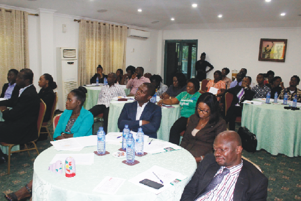 Participants attentively listening to their facilitator at a master class training on emotional management Participants attentively listening to their facilitator at a master class training on emotional management