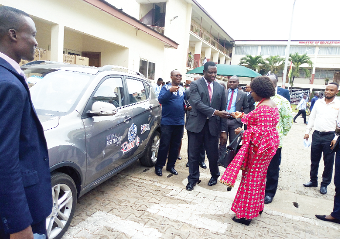 Mrs Millicent Brookman-Amissah, the General Manager of the EPP Books Services, presenting the keys to the saloon car to Dr Adutwum Mrs Millicent Brookman-Amissah, the General Manager of the EPP Books Services, presenting the keys to the saloon car to Dr Adutwum