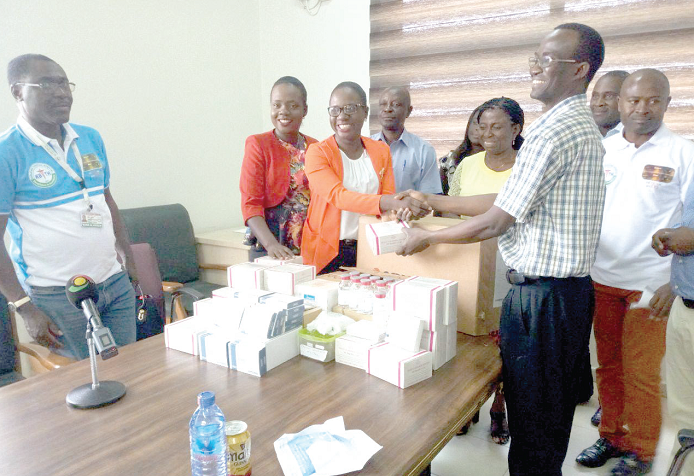 Dr Dzifa Anyah-Nani and Dr Emefa Anyah-Lartey, Daughters of the chief executive officer of the Korle Bu Teaching Hospital presenting the essential medicines to an official of the hospital Dr Dzifa Anyah-Nani and Dr Emefa Anyah-Lartey, Daughters of the chief executive officer of the Korle Bu Teaching Hospital presenting the essential medicines to an official of the hospital