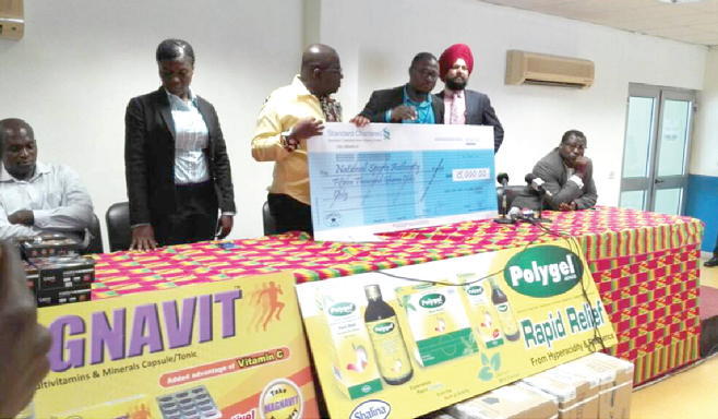  Mr Robert Sarfo Mensah (left) receiving a dummy cheque from Mr Amrit Pal Singh and Eric Nii Borketey, Head of Communications at Shalina.