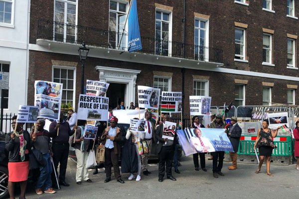 A group of Kenyans protest against President Kenyatta's rule outside Chatham House in London on April 17, 2018. A group of Kenyans protest against President Kenyatta's rule outside Chatham House in London on April 17, 2018.