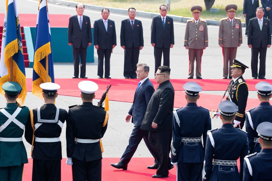 Kim Jong Un walks with Moon Jae-in down a red carpet past a welcoming ceremony to the summit. Photo credit: KOREA SUMMIT PRESS POOL/AFP/Getty Images Kim Jong Un walks with Moon Jae-in down a red carpet past a welcoming ceremony to the summit. Photo credit: KOREA SUMMIT PRESS POOL/AFP/Getty Images