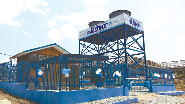 The safe water station. INSET:  The water 'ATM' standpipe which is operated with smart cards