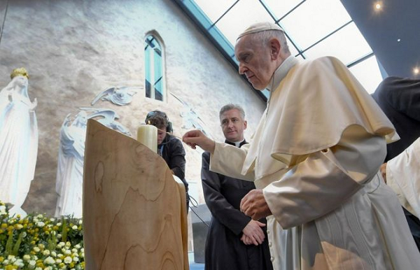 There was silence at the basilica at Knock as Pope Francis lit a candle and prayed There was silence at the basilica at Knock as Pope Francis lit a candle and prayed