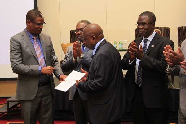 Dr Owen Laws Kaluwa (left) presenting thetrachoma elimination certificate to Mr Kweku Agyemang Manu (3rd left) and Dr Anthony Nsiah-Asare (2nd left) at the ceremony.Picture: EMMANUEL ASAMOAH ADDAI