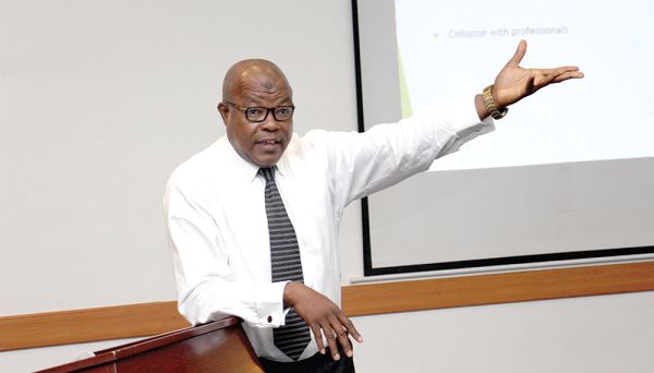  Mr Osumanu Tankan (inset) speaking at the seminar 