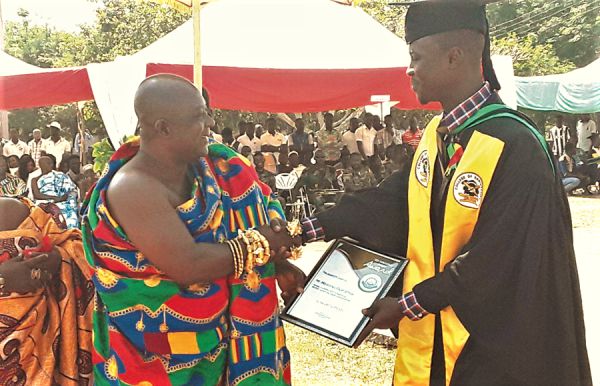 Mr Elija Mawunyo receiving the Overall Best Student award from the Krontihene of the Sunyani Traditional Area, Nana Bofotia Boamponsem II. Mr Elija Mawunyo receiving the Overall Best Student award from the Krontihene of the Sunyani Traditional Area, Nana Bofotia Boamponsem II.