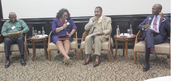 Mrs Jemima Oware, (2nd left), speaking at the seminar while other panellists look on. Mrs Jemima Oware, (2nd left), speaking at the seminar while other panellists look on.