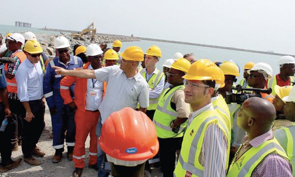 Mr David Benayum of Amandi Holdings (hand stretched) breifing Mr Amewu (third left) on the project Mr David Benayum of Amandi Holdings (hand stretched) breifing Mr Amewu (third left) on the project