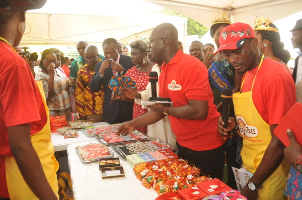 Mr Joseph Boahen Aidoo and Nana Agyenim Boateng sampling some products made from cocoa which were mounted as part of the National Cocoa Day. Mr Joseph Boahen Aidoo and Nana Agyenim Boateng sampling some products made from cocoa which were mounted as part of the National Cocoa Day.