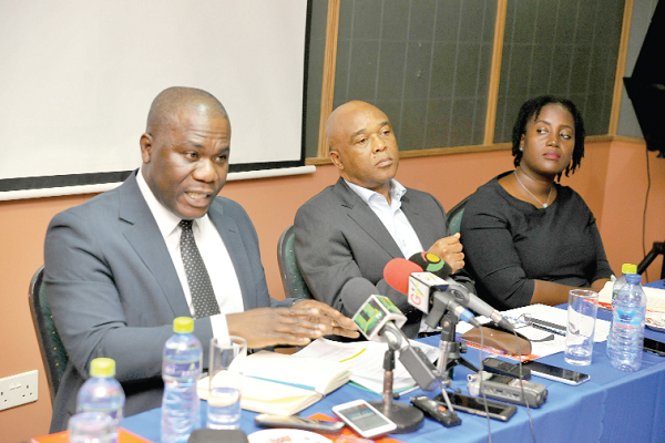 Mr Eric Asubonteng (left) addressing the press conference. With him are Mr David Noko, Executive Vice President, Group Sustainable Development, AngloGold Ashanti, and Mrs Juliet Manteaw-Kutin, Head of the Legal Office, AngloGold Ashanti (Ghana) Limited