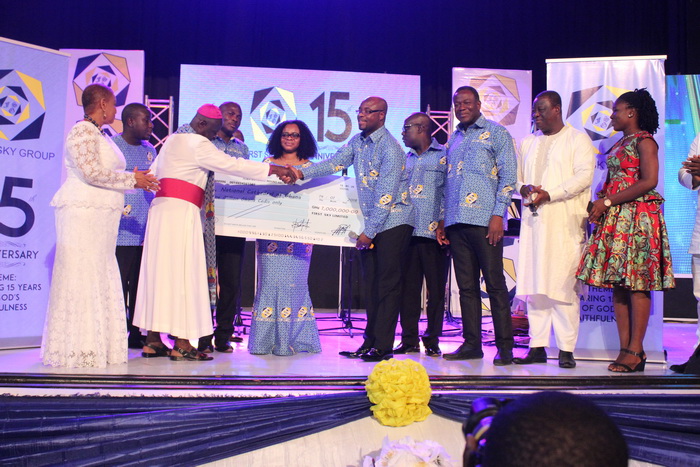 Mr Eric Seddy Kutortse (4th right), Chairman and CEO of First Sky Group presenting a dummy cheque to Most Rev. Dr Samuel Asante Antwi, the Chairman of the National Cathedral trustee. With them are Mr Kofi Dzamesi (3rd right), the Minister of Chieftaincy and Religious Affairs, Mr Kwasi Amoako Attah (2nd right), the Minister of Roads and Highways and some staff of First Sky Group Mr Eric Seddy Kutortse (4th right), Chairman and CEO of First Sky Group presenting a dummy cheque to Most Rev. Dr Samuel Asante Antwi, the Chairman of the National Cathedral trustee. With them are Mr Kofi Dzamesi (3rd right), the Minister of Chieftaincy and Religious Affairs, Mr Kwasi Amoako Attah (2nd right), the Minister of Roads and Highways and some staff of First Sky Group