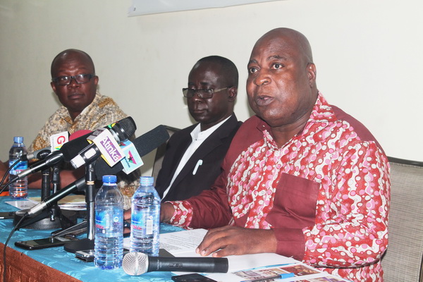 Mr Ishmael Ashitey (right), Greater Accra Regional Minister, giving the keynote address. With him are Mr Harold Esseku (left), Consultant at the World Bank, and Mr Anthony Mensah (middle), Director of Sanitation at the Ministry of Sanitation and Water Resources (MSWR).