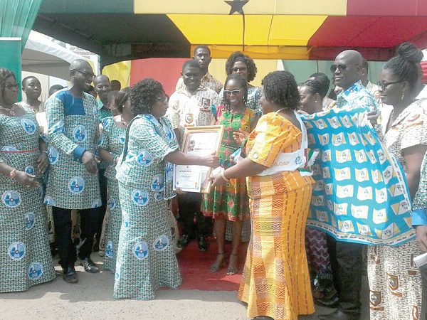 Mrs Margaret Frempong-Kore, (4th left), acting Greater Accra Regional Director of Education, presenting the best head teacher award, SHS category, to Mrs Elizabeth Ama Asare, Headmistress of Tema Senior High School. Mrs Margaret Frempong-Kore, (4th left), acting Greater Accra Regional Director of Education, presenting the best head teacher award, SHS category, to Mrs Elizabeth Ama Asare, Headmistress of Tema Senior High School.