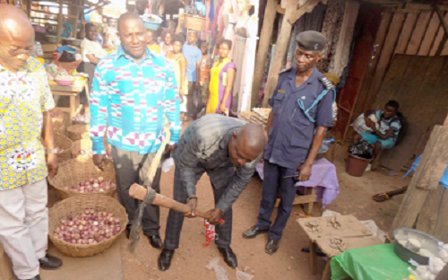 Mr Antwi-Boasiako (with pickaxe in hand) cutting the sod for the construction of the stores Mr Antwi-Boasiako (with pickaxe in hand) cutting the sod for the construction of the stores