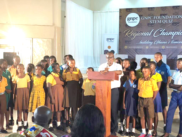 Dr K.K Sarpong (with microscope), the Chief Executive Officer of the Ghana National Petroleum Corporation (GNPC), addressing the contestants.