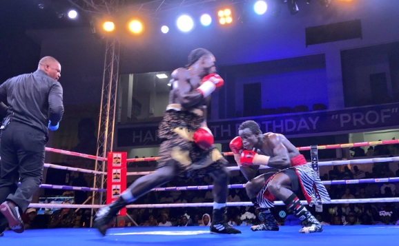 Osei-Bonsu crouches before his conqueror Ayi during the bout. Azumah Nelson Fight Night: Ayi dethrones Osei-Bonsu