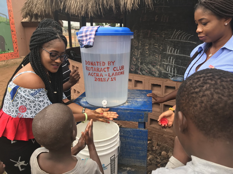 The children being taken through hand washing procedure