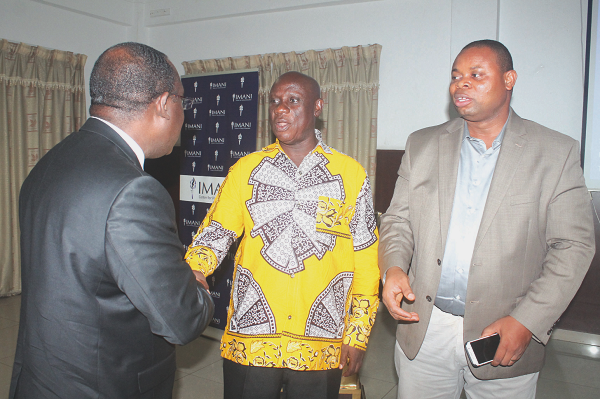 Nana Obiri Boahen (middle) in a handshake with Mr Kofi Bentil (back to camera). Looking on is Mr Franklin Cudjoe. Nana Obiri Boahen (middle) in a handshake with Mr Kofi Bentil (back to camera). Looking on is Mr Franklin Cudjoe.