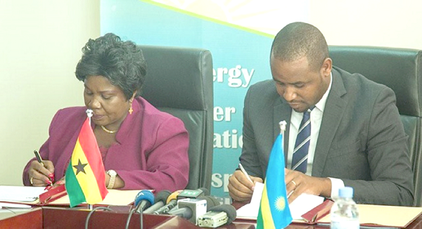 Ms Cecilia Abena Dapaah, the Minister of Aviation, and Mr Jean De Dieu Uwihanganye, the Minister of State in charge of Transport in Rwanda, signing the agreement