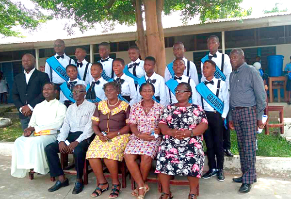 The graduates in a group photograph with the administrators of the school. The graduates in a group photograph with the administrators of the school.