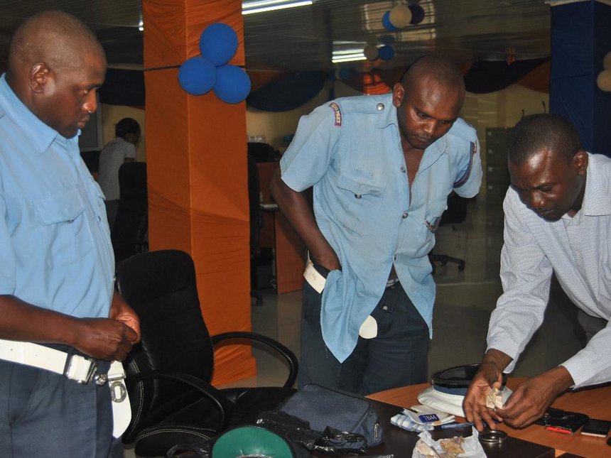 Library photo: EACC officers search traffic police officers arrested while taking bribes in Kilifi in June 2015. Library photo: EACC officers search traffic police officers arrested while taking bribes in Kilifi in June 2015.