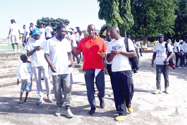 Herbert Mensah (middle) explaining a point to some of the participants in the walk Herbert Mensah (middle) explaining a point to some of the participants in the walk