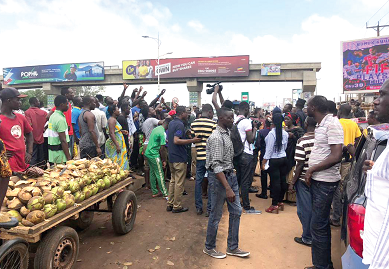 Residents of Adenta in a peace walk along the highway Residents of Adenta in a peace walk along the highway