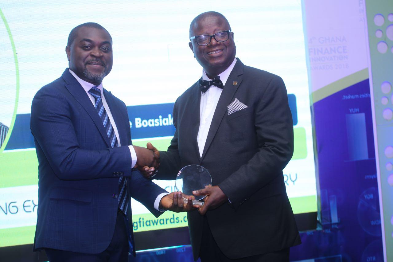 Mr Akin Naphtal presenting the Life Time Achievement award to Prof Kwame Boasiako Omane-Antwi Mr Akin Naphtal presenting the Life Time Achievement award to Prof Kwame Boasiako Omane-Antwi