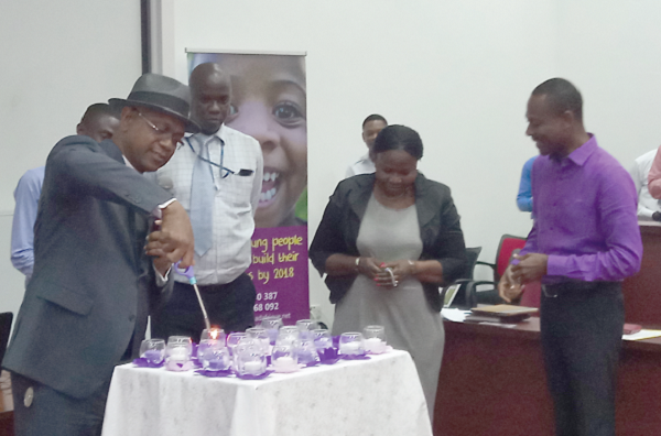Reverend Kennedy Okosun (left)lights a candle to launch the competition Reverend Kennedy Okosun (left)lights a candle to launch the competition
