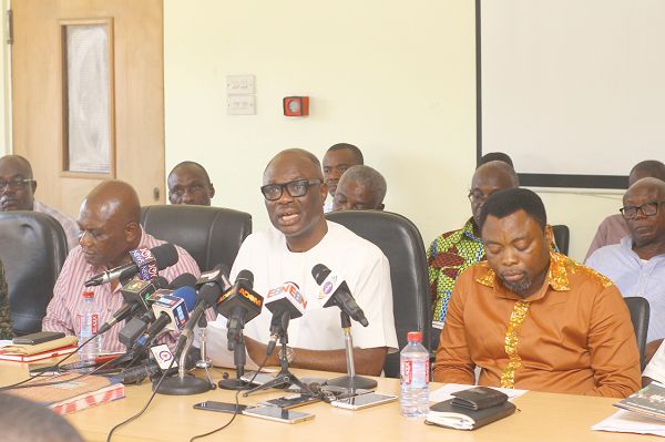 Dr Joseph Obeng (middle), GUTA President addressing the press conference in Accra. Those with him are Mr Osei - Brenya (left), First Vice, Mr Charles Gyan (right), Vice President. Picture: NII MARTEY M. BOTCHWAY