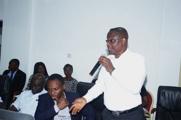 Dr Simons Akorli (right) Director, Regulatory Economics and Research at the PURC, addressing the participants in the meeting in Accra. Picture: GABRIEL AHIABOR