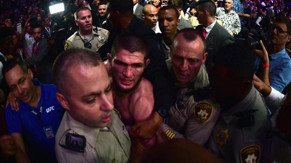 Khabib Nurmagomedov was escorted from the arena by police Khabib Nurmagomedov was escorted from the arena by police