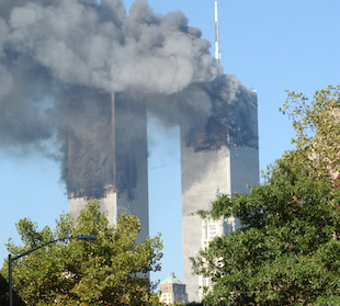 The World Trade Towers after the impact on 9/11 The Towers on 9/11