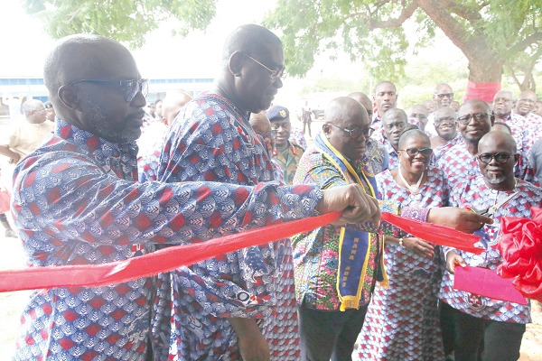 President Nana Addo Dankwa Akufo-Addo (3rd left) being assisted by Mr Frank Adu Jnr (left), the Managing Director of Cal Bank and alumnus of the school, and Lady Queene Asiedu Akrofi, to cut a tape to inaugurate a library for the school. Picture: SAMUEL TEI ADANO President Nana Addo Dankwa Akufo-Addo (3rd left) being assisted by Mr Frank Adu Jnr (left), the Managing Director of Cal Bank and alumnus of the school, and Lady Queene Asiedu Akrofi, to cut a tape to inaugurate a library for the school. Picture: SAMUEL TEI ADANO